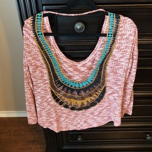 Loosely fitting sweater with open back